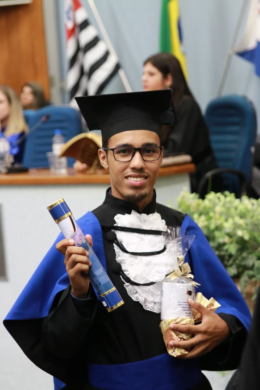 Me standing on graduation day in college